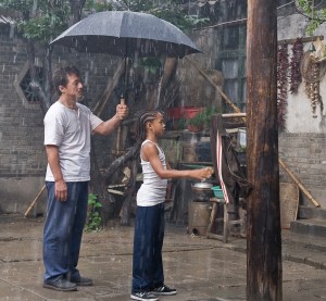 Mr Han teaching Dre kung fu with his jacket.